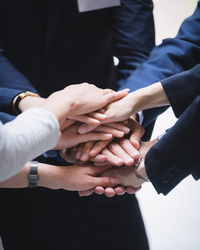 close-up of hands stack of business people